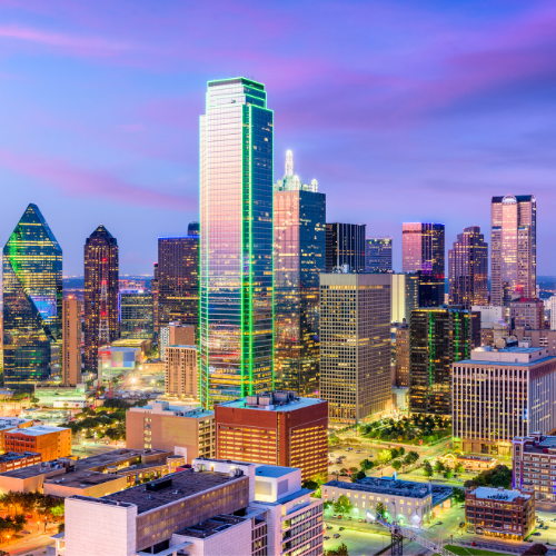 Aerial view of a vibrant Dallas skyline with modern homes and buildings.